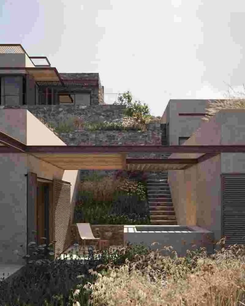 Stone-clad exterior walls blending harmoniously with the oxidized rock formations of Limnos.