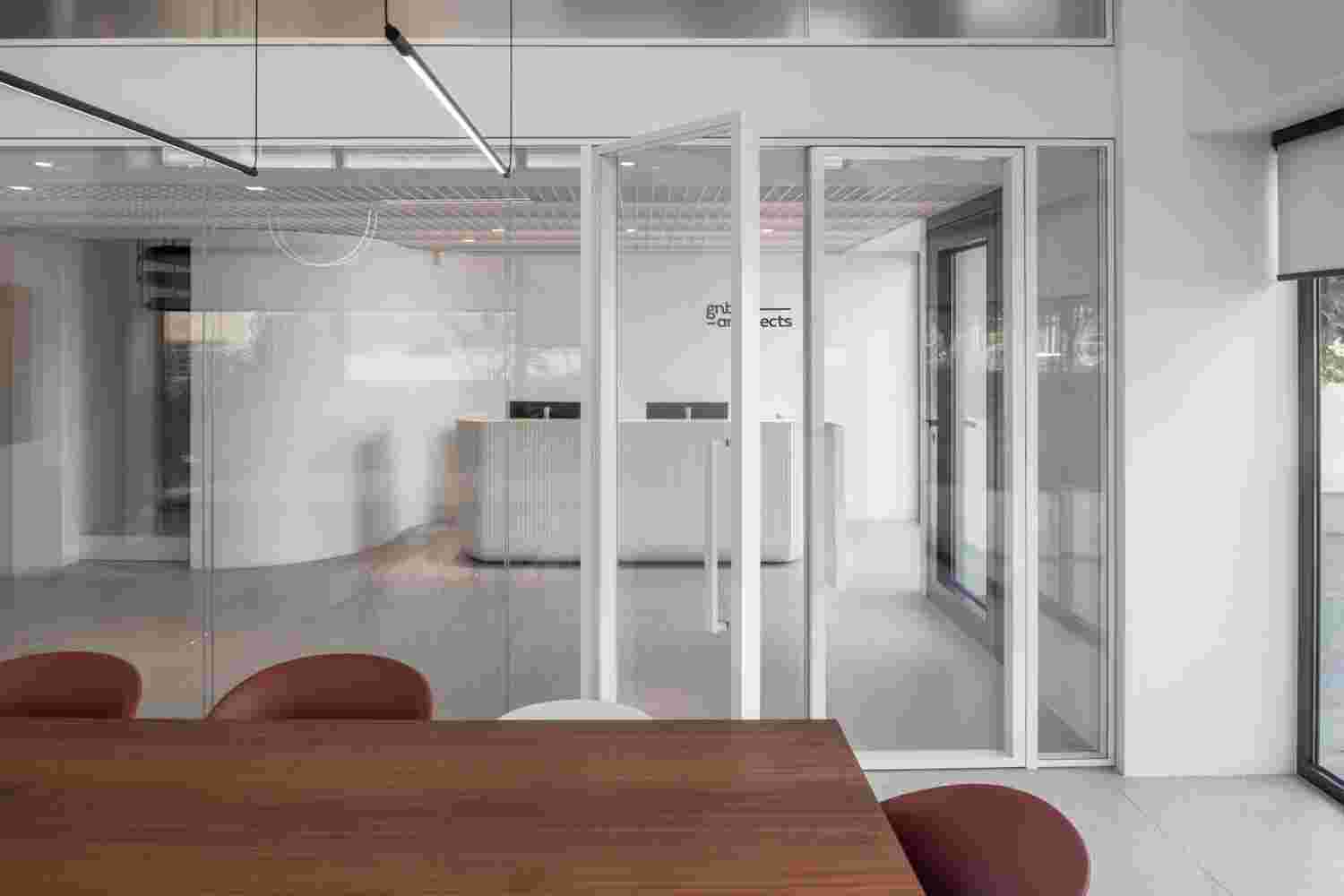 Glass-walled meeting space in the office.