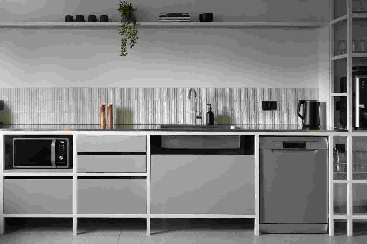 Modern kitchen design with minimalist features and neutral color palette.