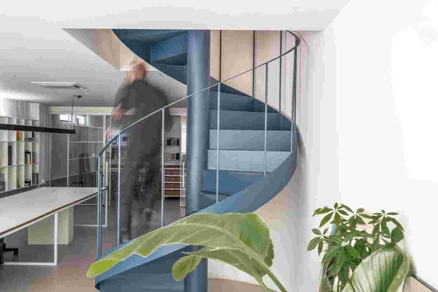 Open staircase with sleek metal details.