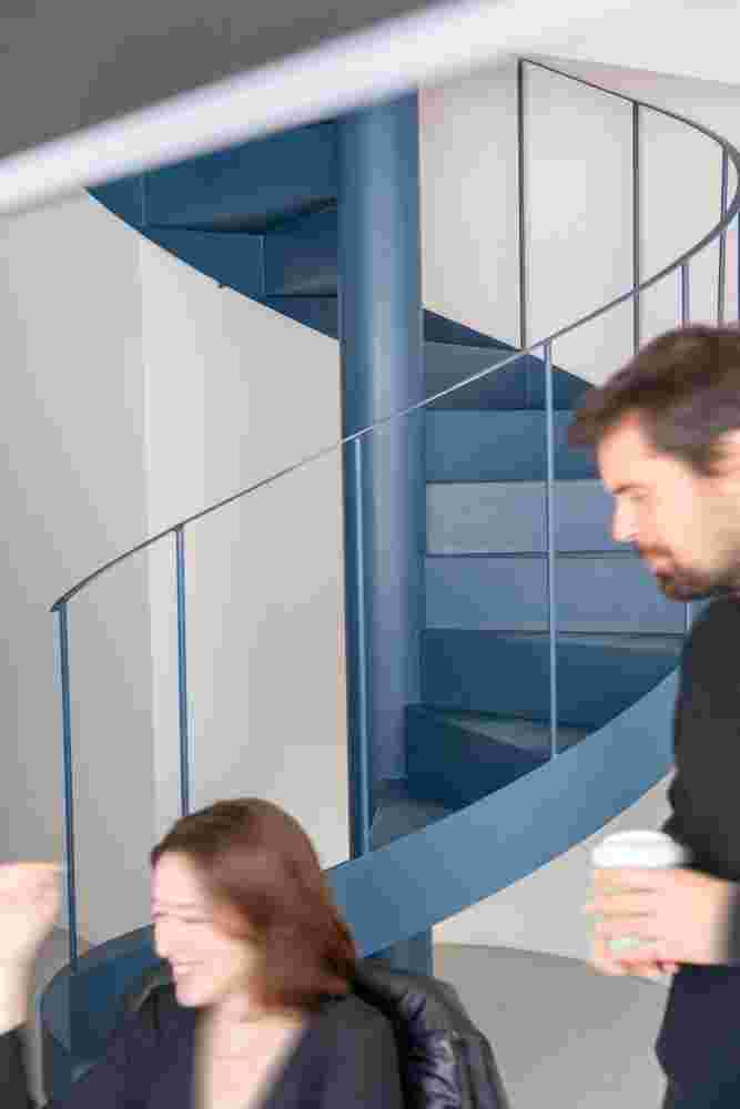 Staircase leading to the basement with modern design.