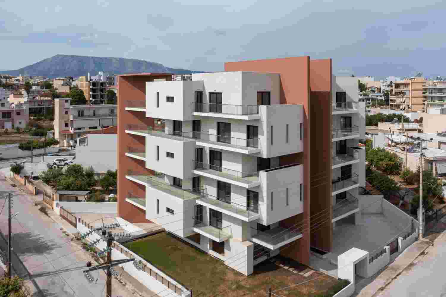 Modern suburban housing project Prismatic in Spata Greece with geometric facade and stacked white volumes