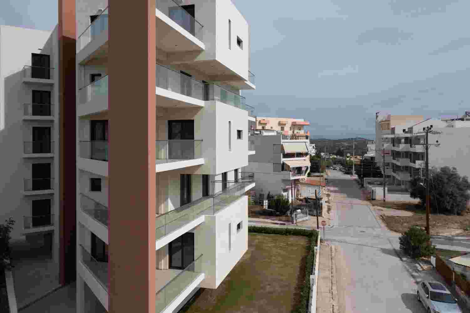 Layered balcony system and geometric volumes in Prismatic residential architecture Athens area